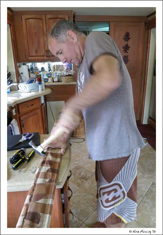 Paul puts some elbow grease into ripping fabric off the old valences