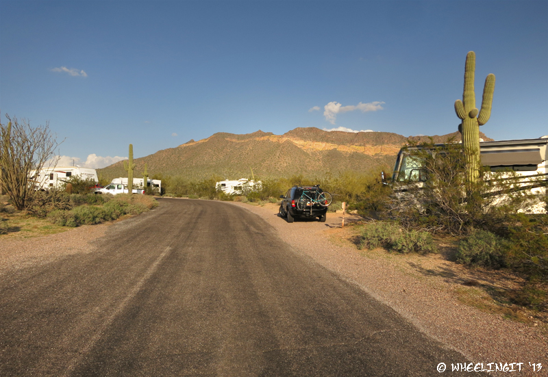 View down east side of campground. RV in site #48 on right with #50 behind it.