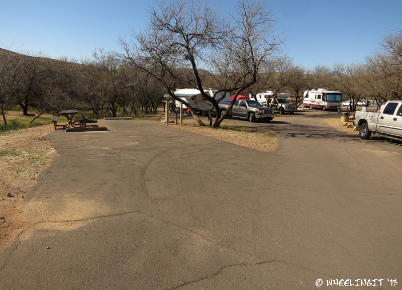 View towards beach-end of West Campground. Site #52 on left (empty) with #50, #49 behind. Sites get closer as you get further back.