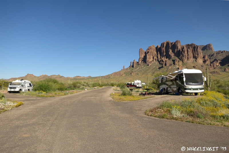 View of large pull-throughs down left-side of campground. Site #49 on right with #47 behind it. Site #46 on left.