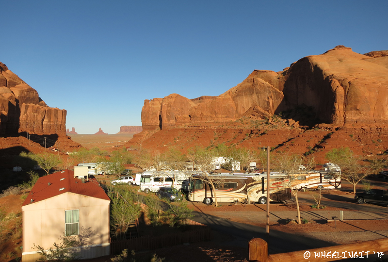 View down the row from top. Our RV on right. Slot view of Monument Valley in background.