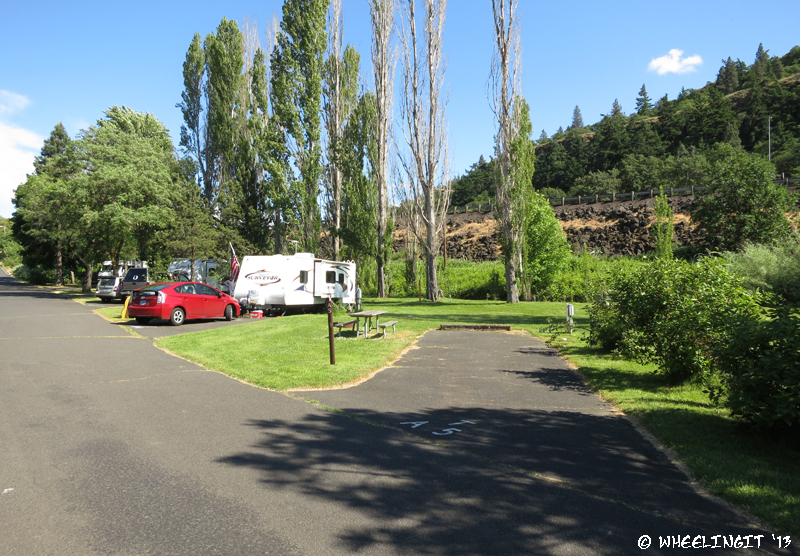 Another view down back. Empty site A5 with RV in A4 beside it. You can see the rail from I-84 in the back.