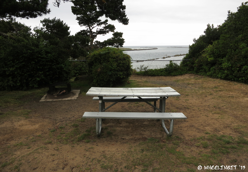 View of picnic table and fire-pit. This is premier site #13, the only one with a view.