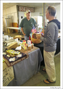 Paul chats to the butcher-block guy at Bandon market