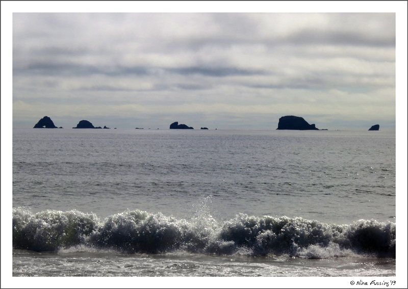 Waves echo clouds on a moody day