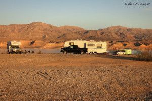 Larger rigs on the "cliffs" towards the right-side of the shoreline.