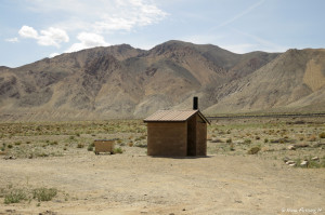 Tamarack Beach -> View of pit toilet & trash dumpster