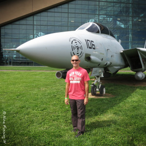 Paul poses in front of an F-14 Tomcat