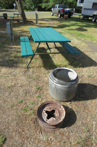 Picnic table and fire-pit at each site. You can see site behind this and another to the back right.
