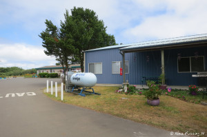 View towards park entrance showing club-house & propane (front) and office (back)