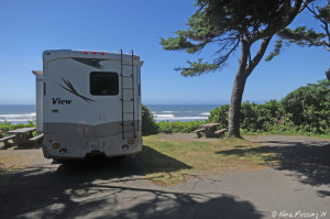 View of beach-facing sites in A-loop. RV in site A23 on left. Empty site A22 on right.