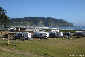 View of RV park from the side. RV's nearest to us are in sites 12-18. We're in the middle of the front-facing row. Beach is in the back ground.
