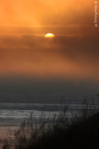 Afternoon fog obscures the sunset