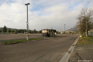 Back view of our spot. We had a nice slice of green to the side of the RV. Doggie walking area on right side.