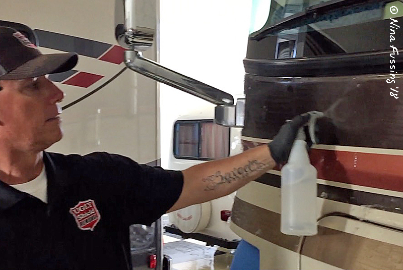 Spraying on the adhesive remover Wheeling It Tales From a Nomadic Life